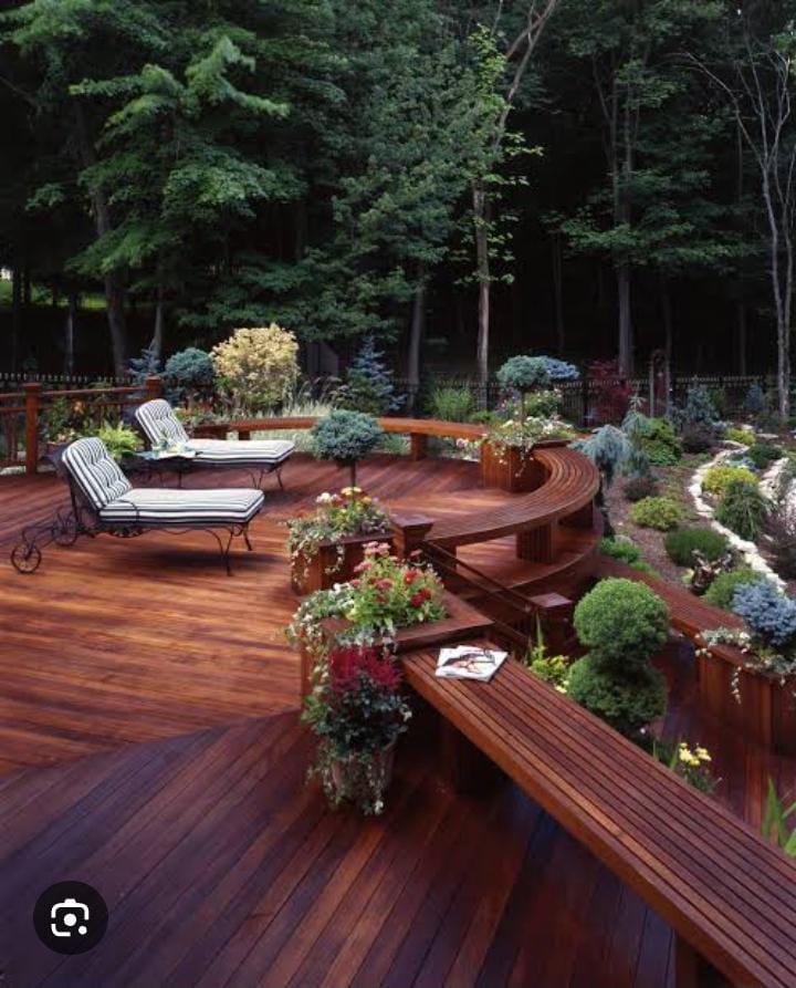 Curved wooden deck with greenery