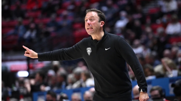 Basketball coach gestures during game