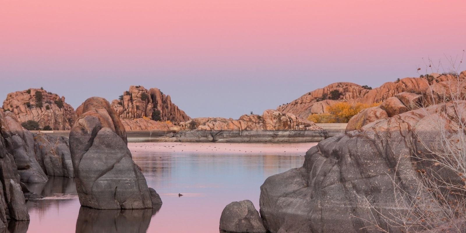 Lake with scattered granite rocks