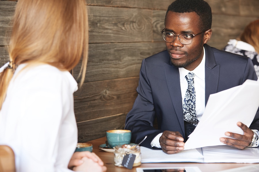 Man at job interview with papers