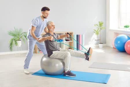 Exercise physiologist assists elderly patient