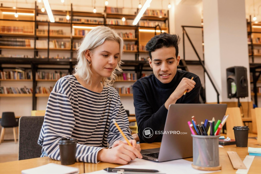 Two coworkers collaborating at desk