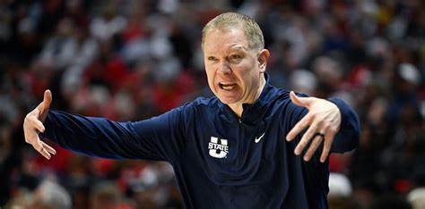 Man wearing blue sweatshirt