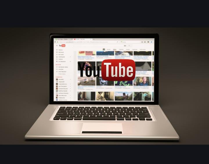 YouTube on laptop dark background