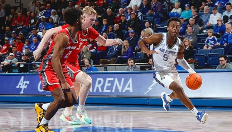 Basketball players competing during game