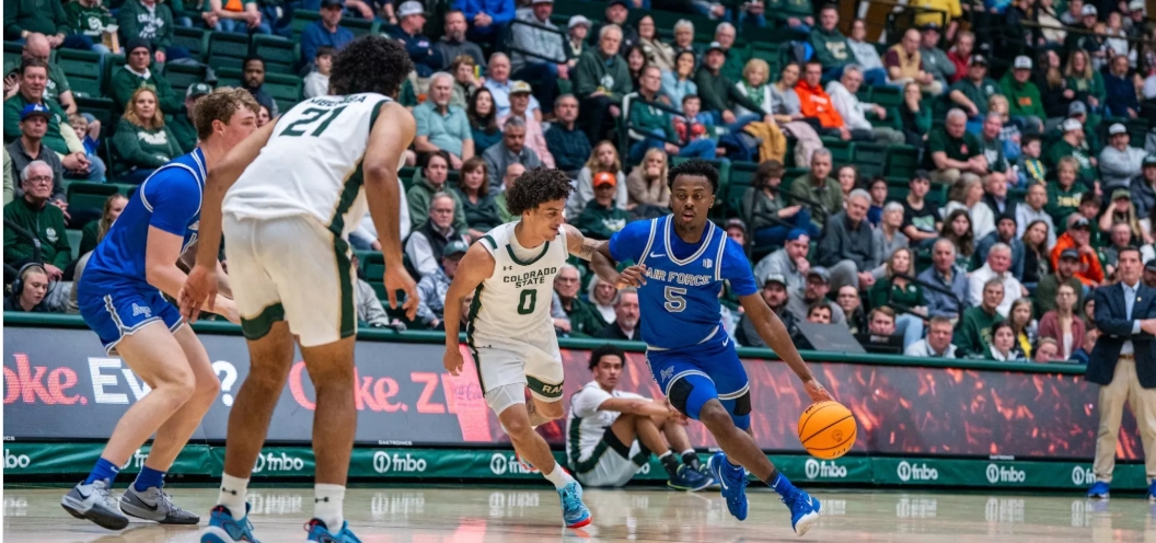 Air Force player dribbles basketball