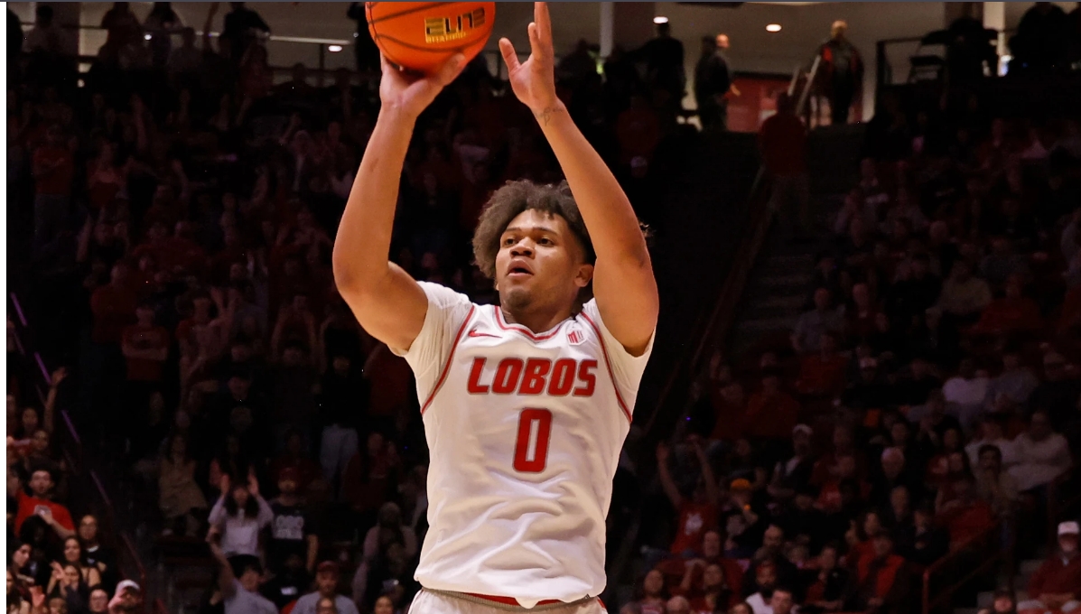 Player shooting basketball at hoop