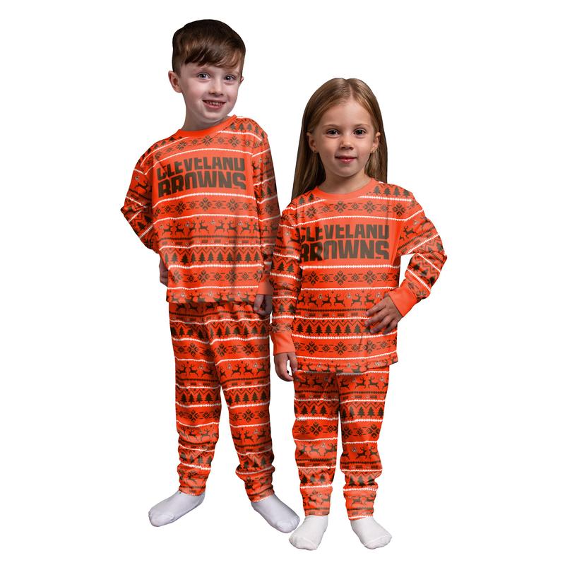 Kids in matching Christmas pajamas