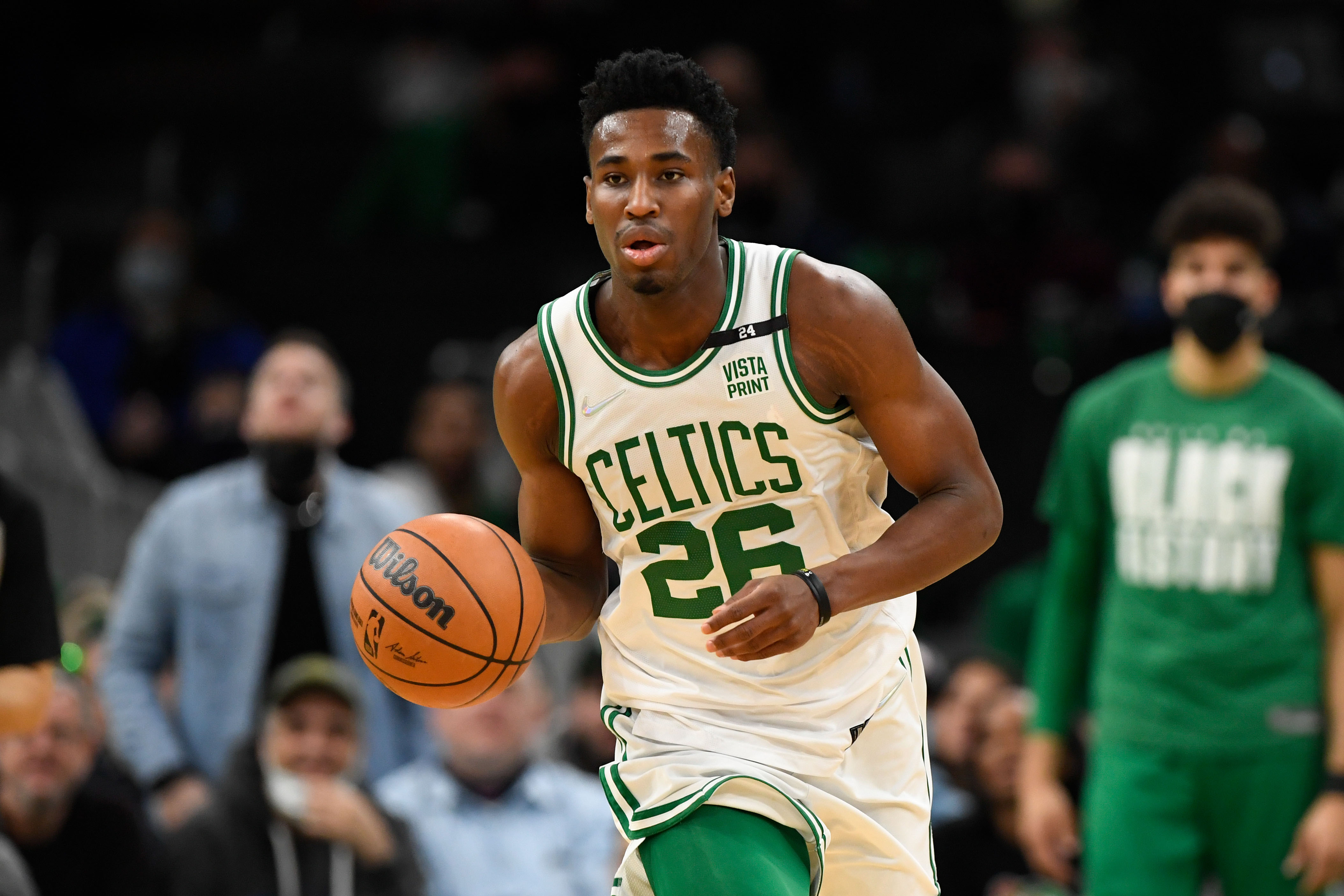 Celtics player shooting basketball