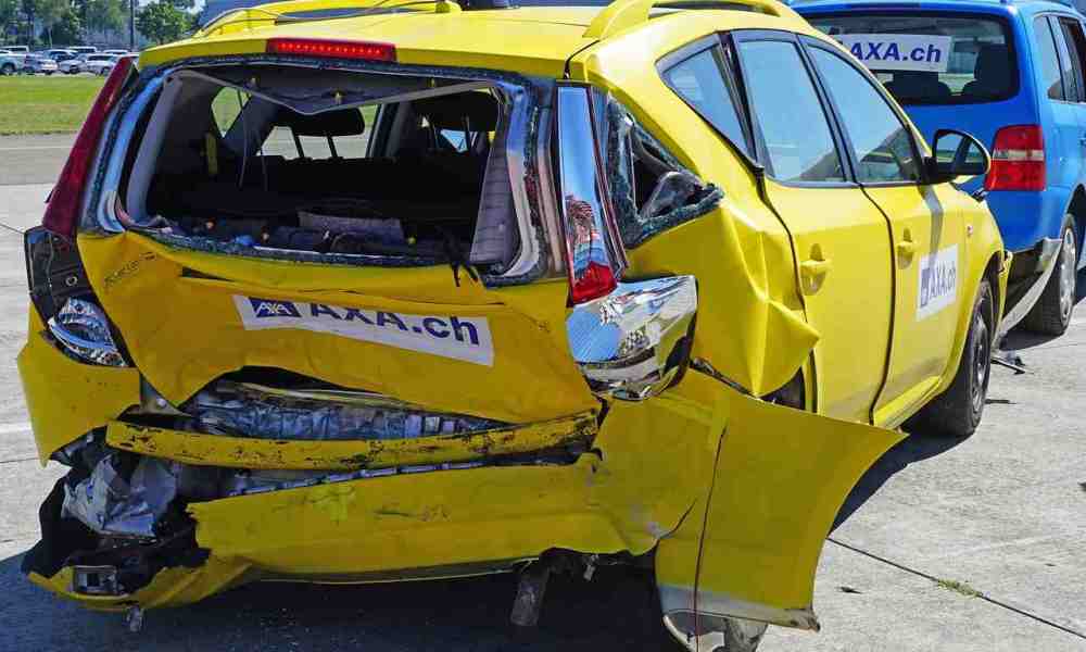 Damaged yellow car rear view