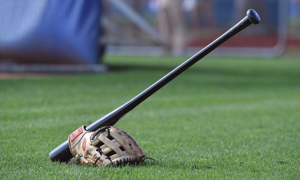 Baseball gear on green field