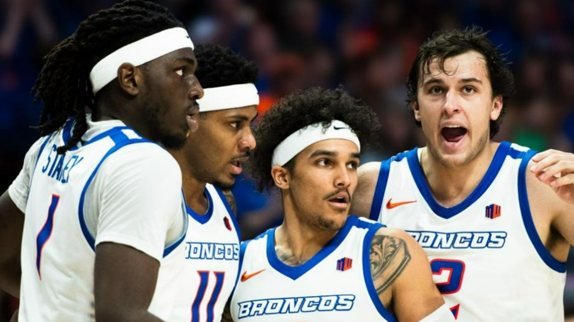 Four players in white uniforms