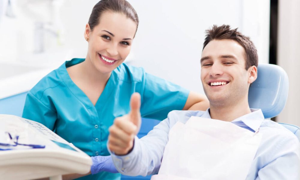 Dentist examining patient during dental checkup